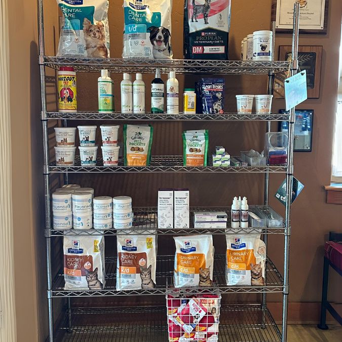 Shelving with pet treats, pet food and medications